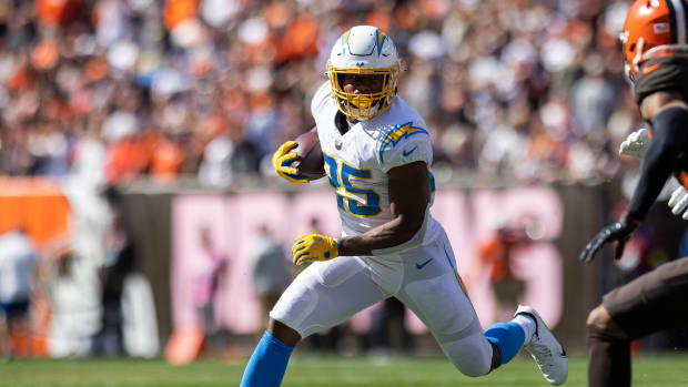 Oct 9, 2022; Cleveland, Ohio, USA; Los Angeles Chargers running back Joshua Kelley (25) runs the ball against the Cleveland Browns during the second quarter at FirstEnergy Stadium. Mandatory Credit: Scott Galvin-USA TODAY Sports